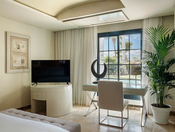 a room with a television and a window