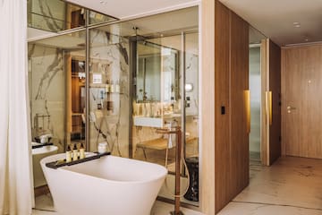 a bathroom with a tub and a sink