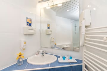 a bathroom with a sink and mirror