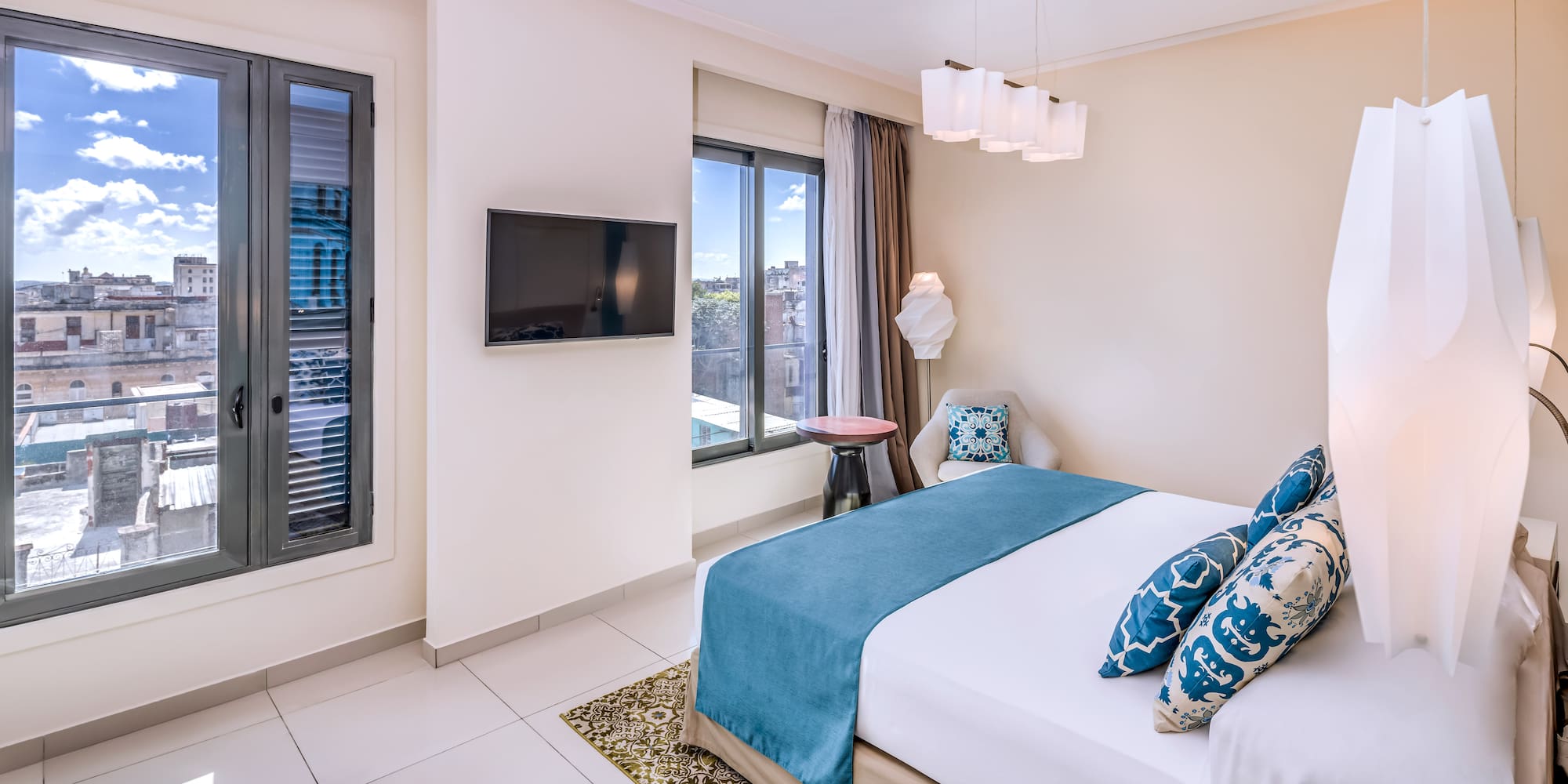 a bedroom with a bed and a television