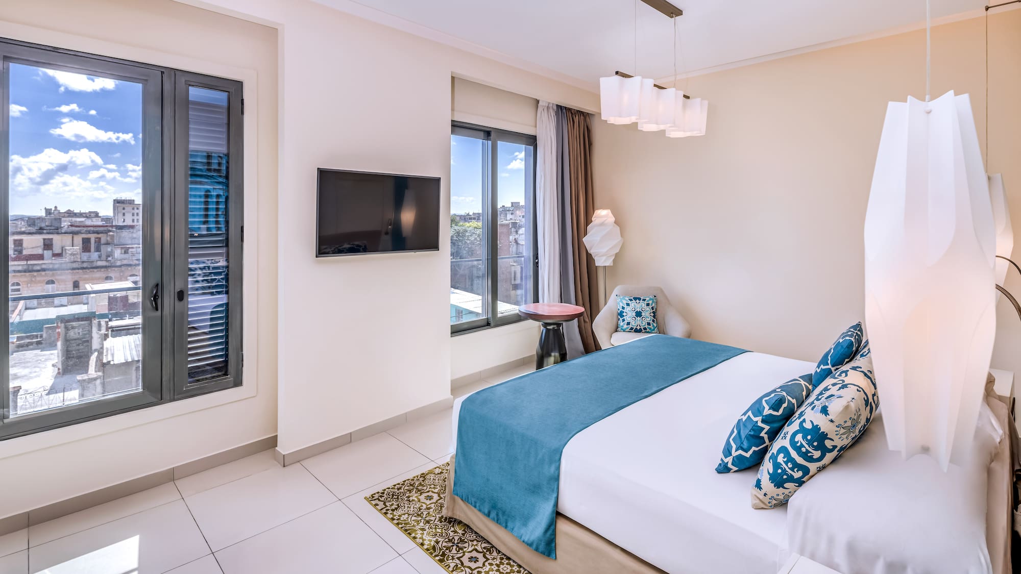 a bedroom with a bed and a television