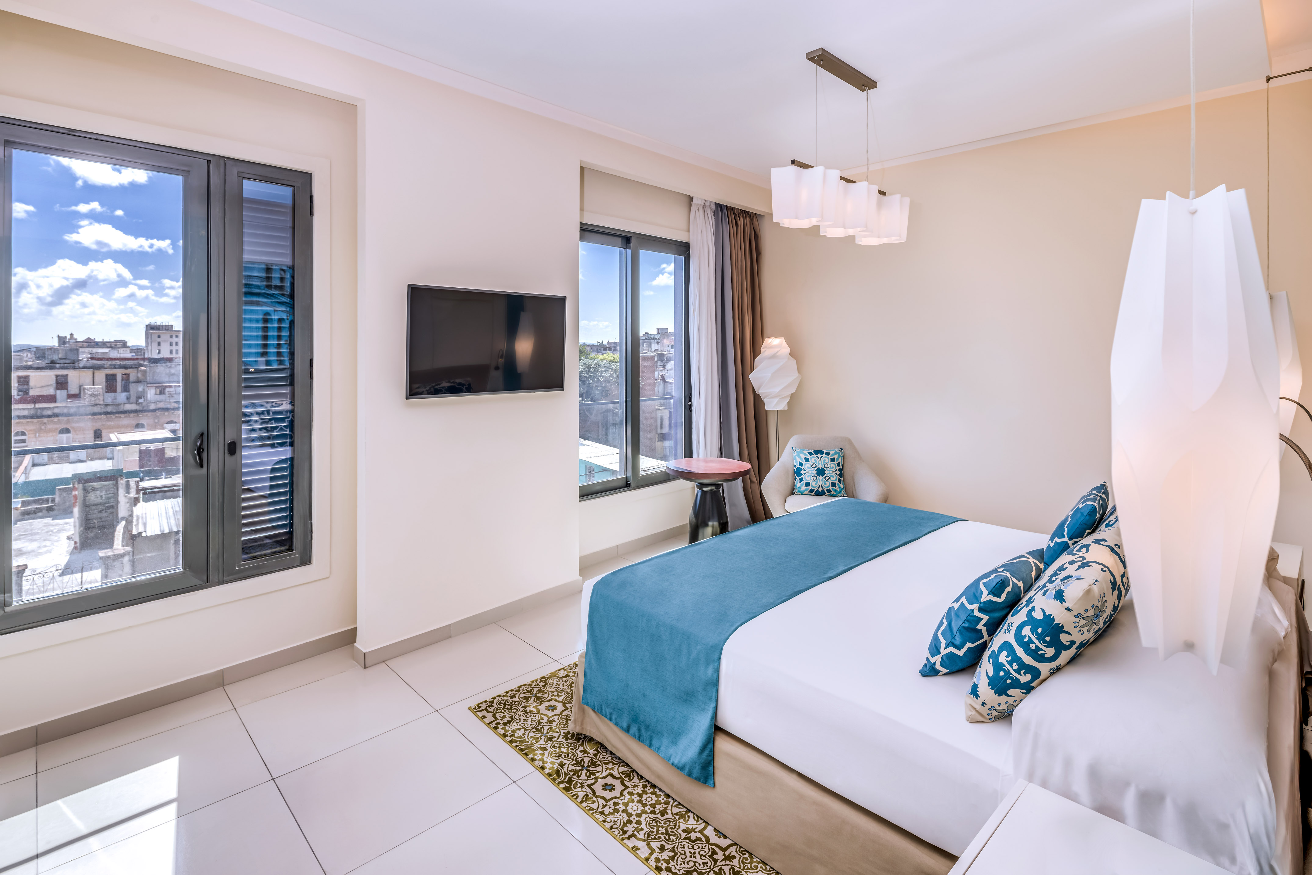 a bedroom with a bed and a television