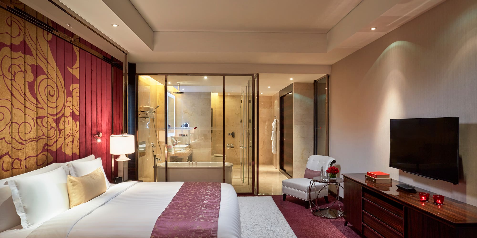 a bedroom with a glass door and a bed