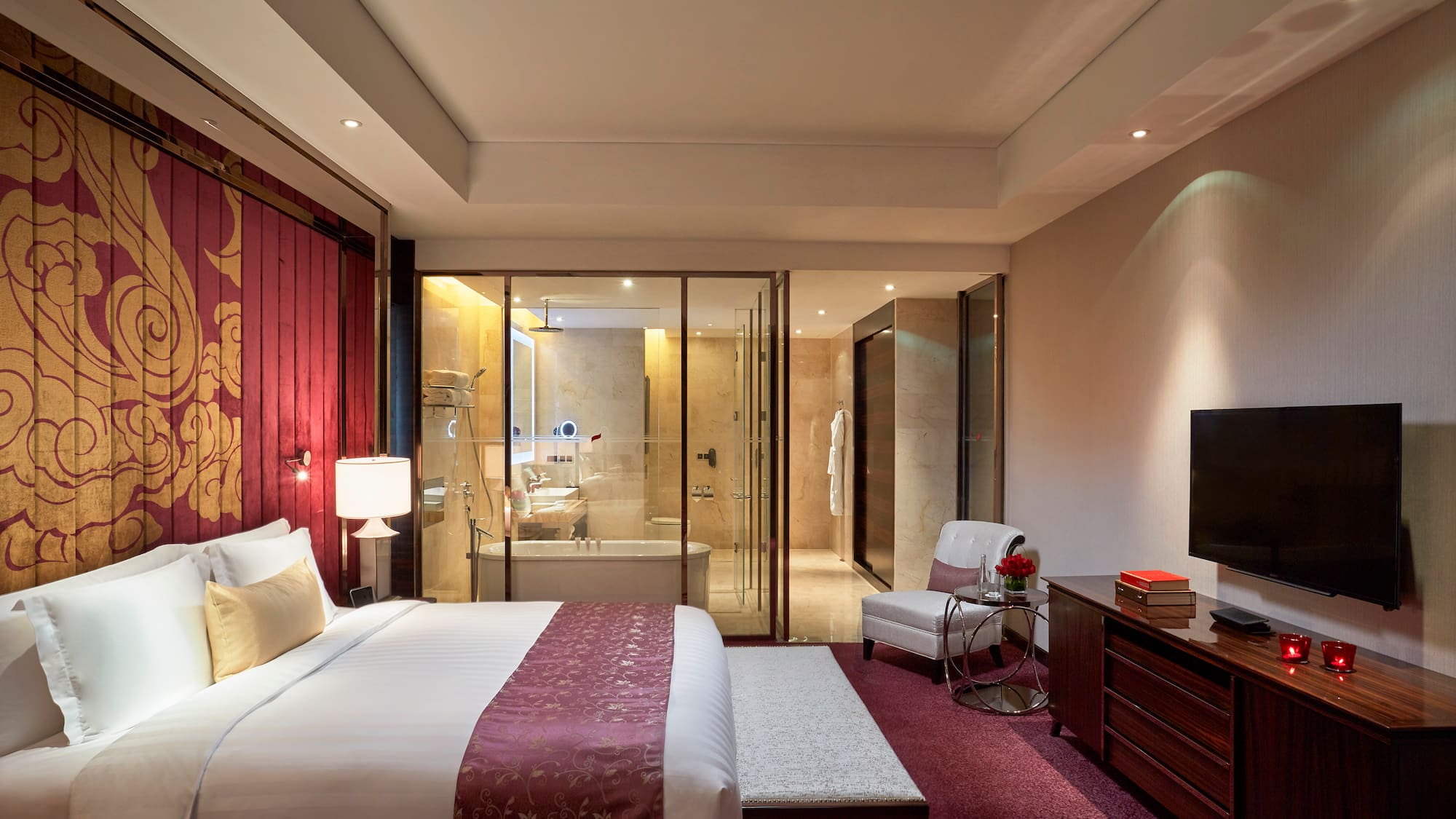 a bedroom with a glass door and a bed