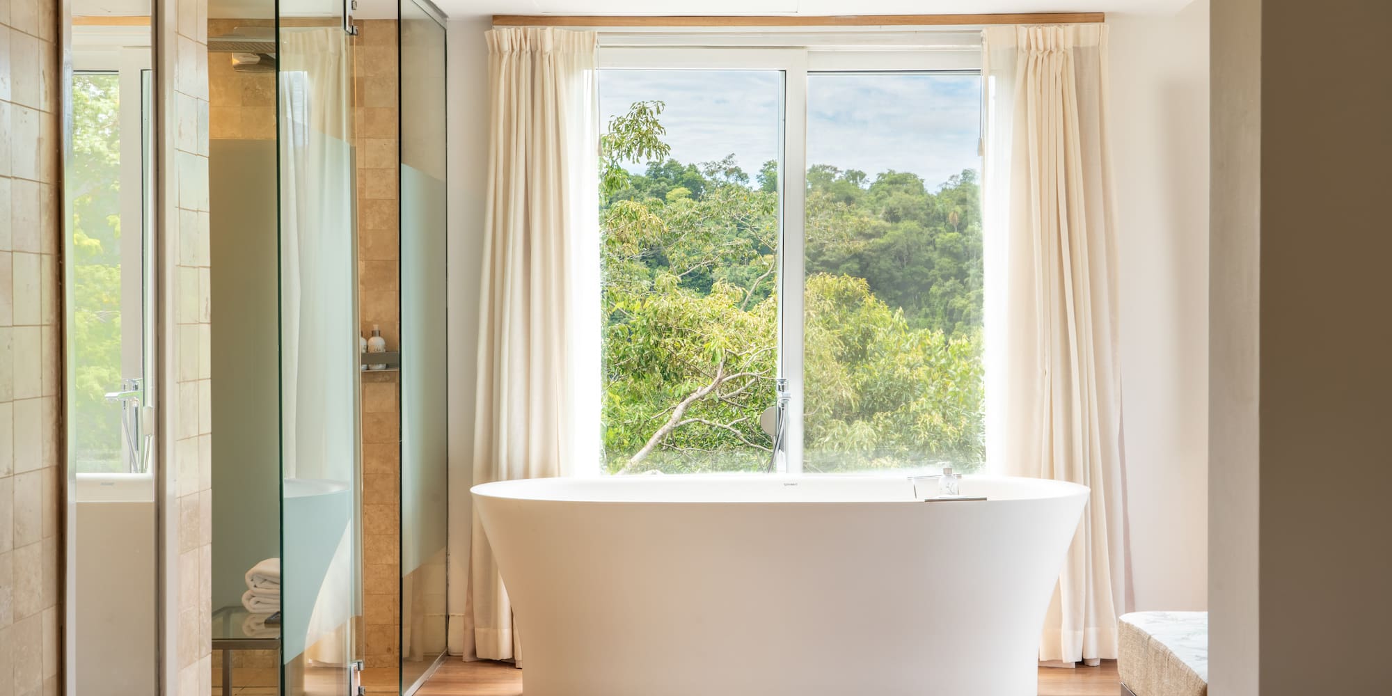 a bathroom with a tub and shower