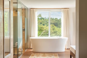 a bathroom with a tub and shower