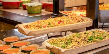 food on a trays with sauces
