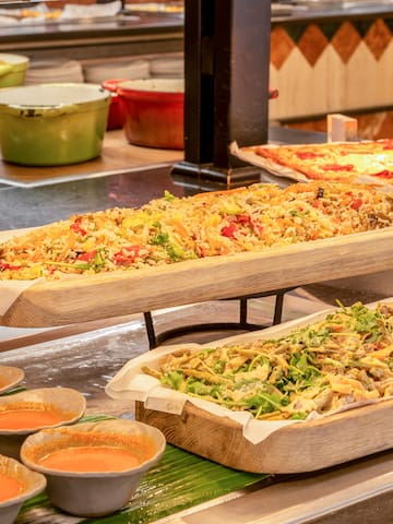 food on a trays with sauces
