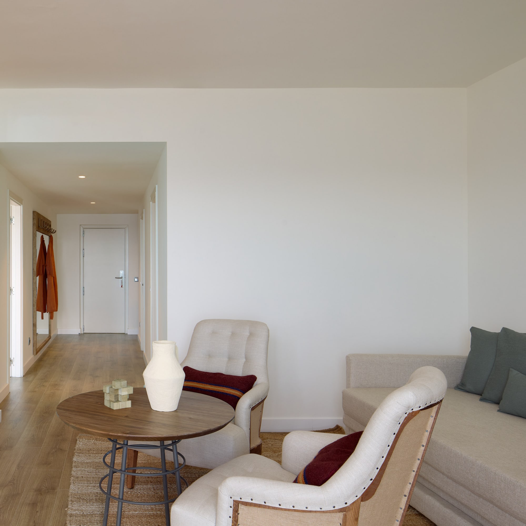 a living room with a couch and chairs