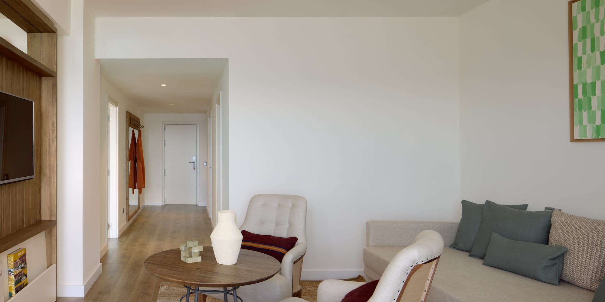 a living room with a couch and chairs