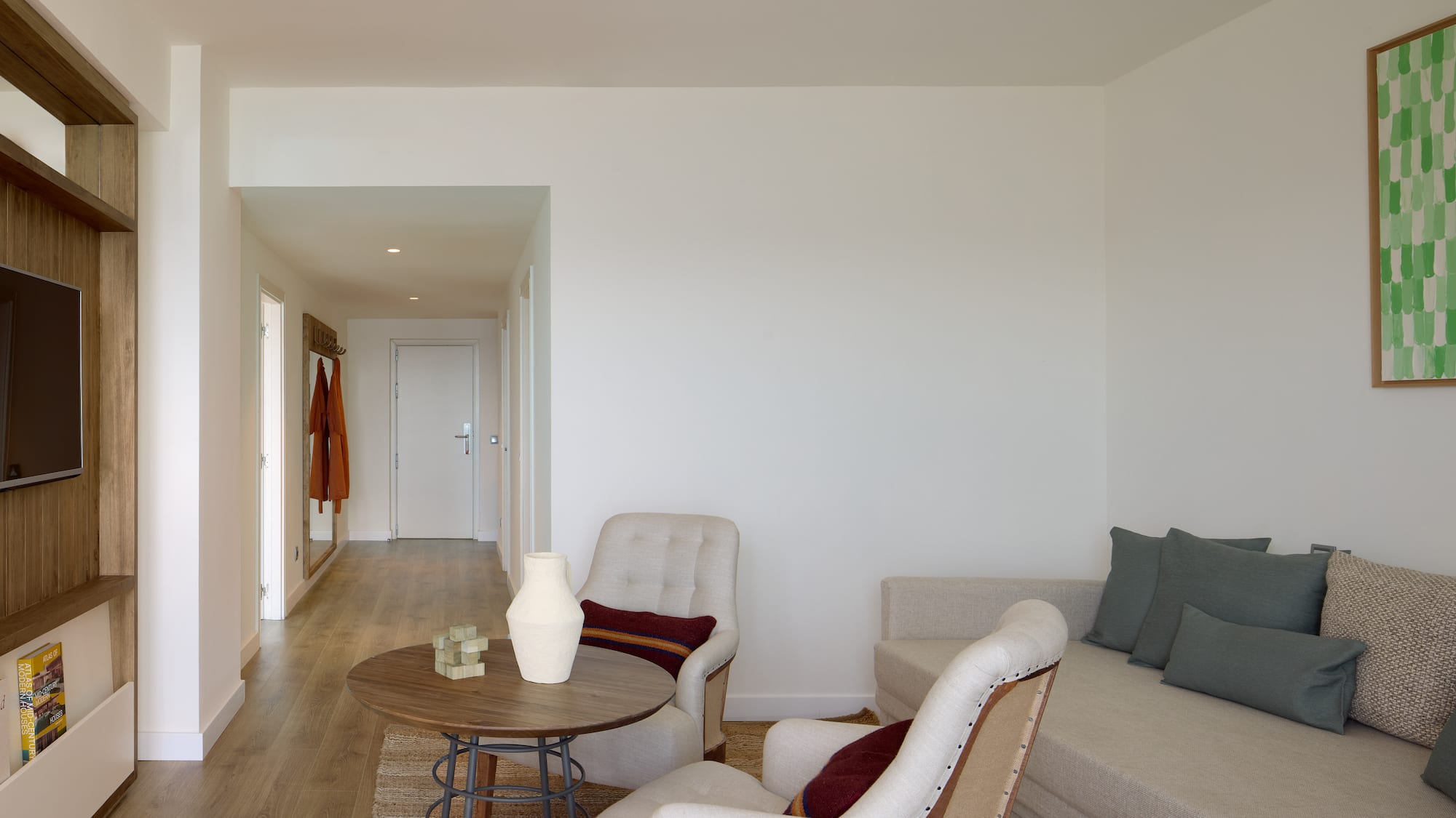 a living room with a couch and chairs