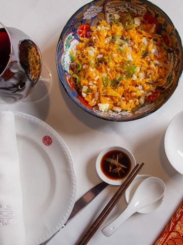 a plate with food and a glass of wine