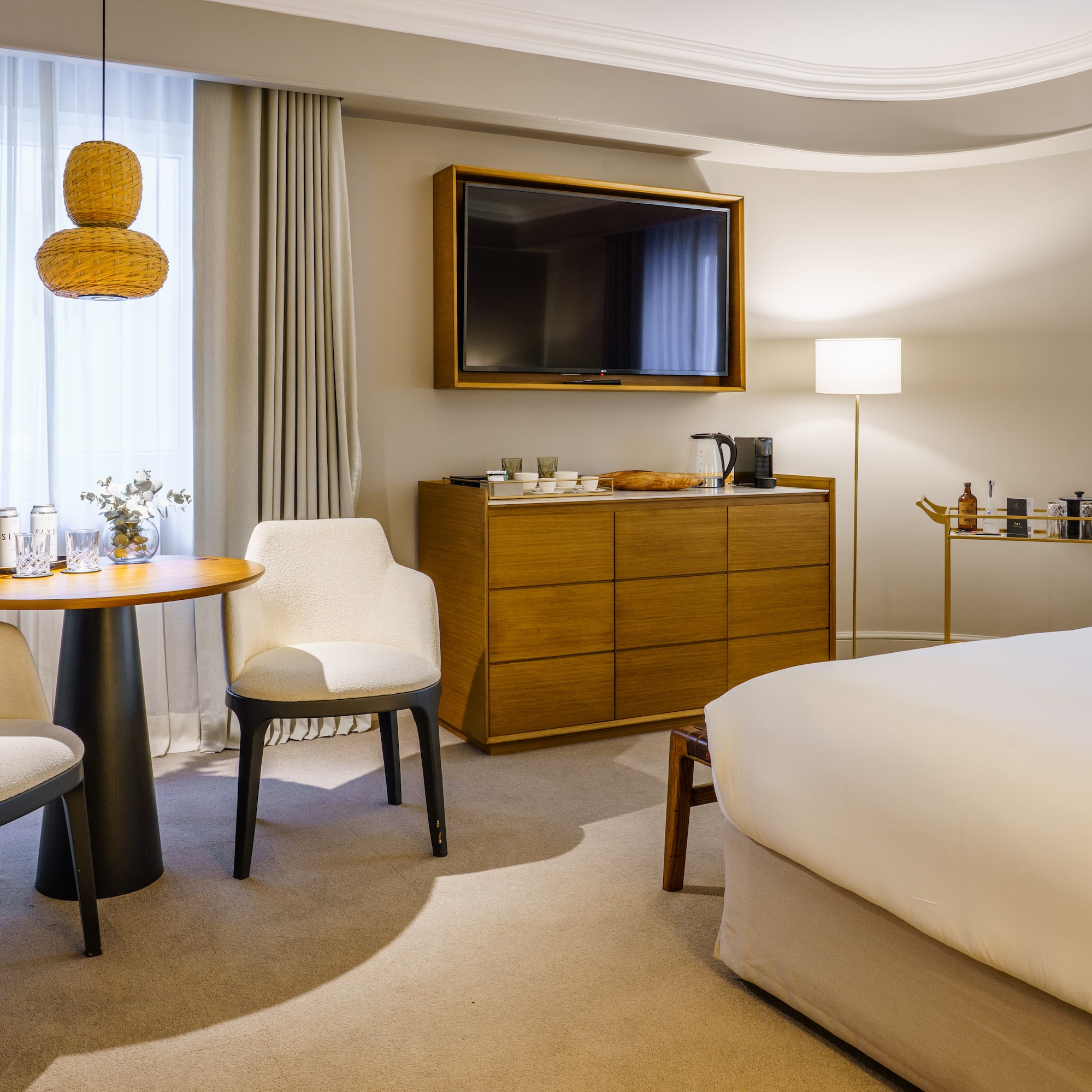 a room with a bed and a television