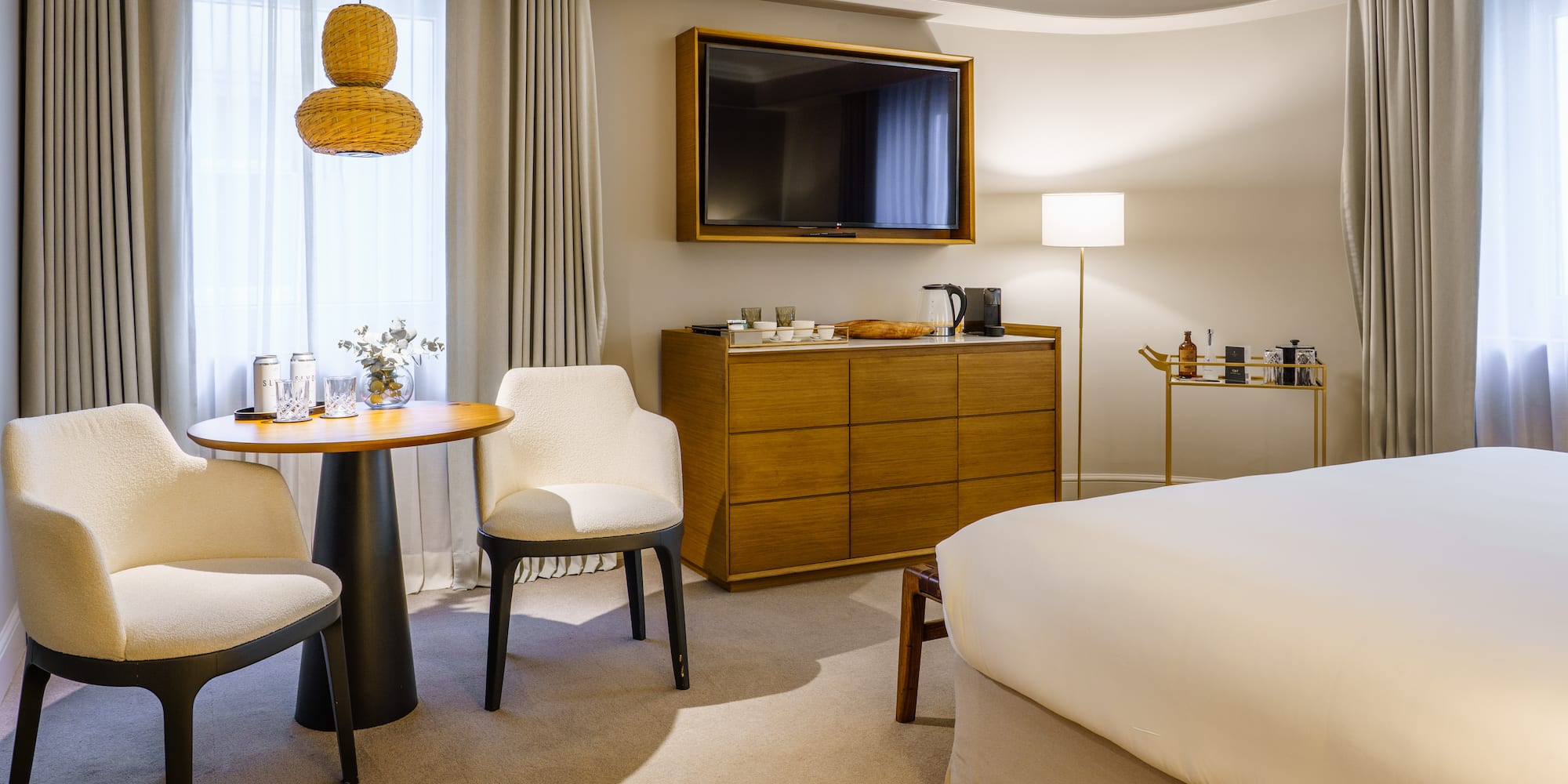 a room with a bed and a television