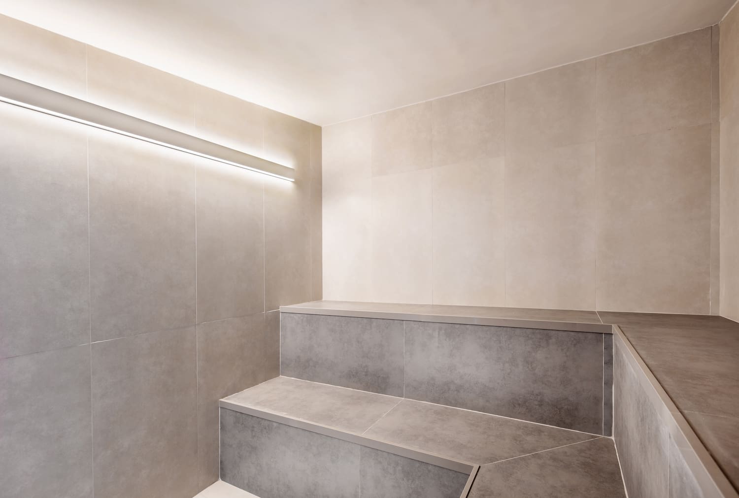 a room with a bench and a light