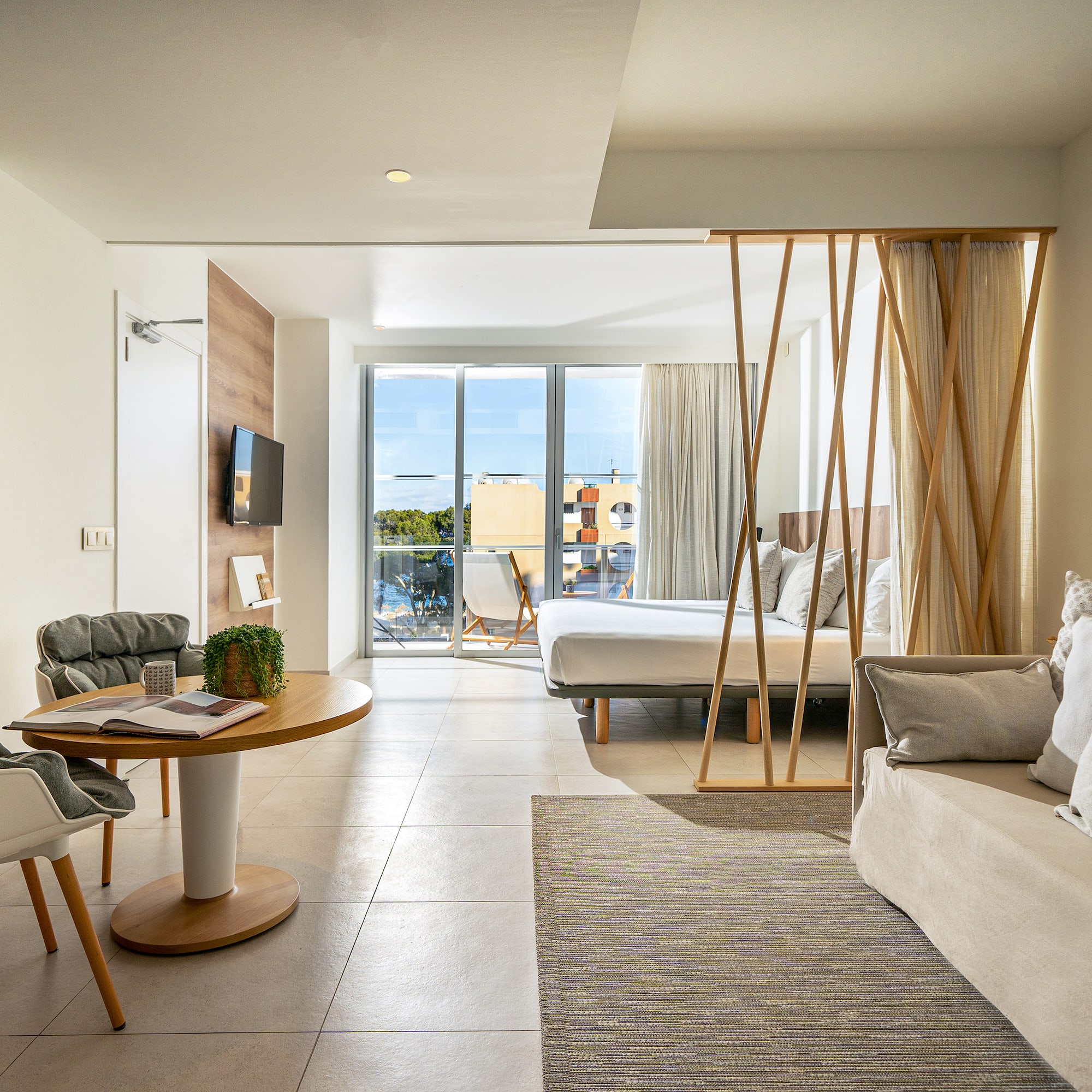 a room with a bed and a sofa