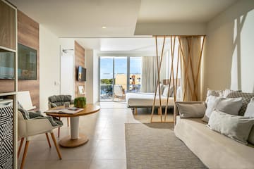 a room with a bed and a sofa