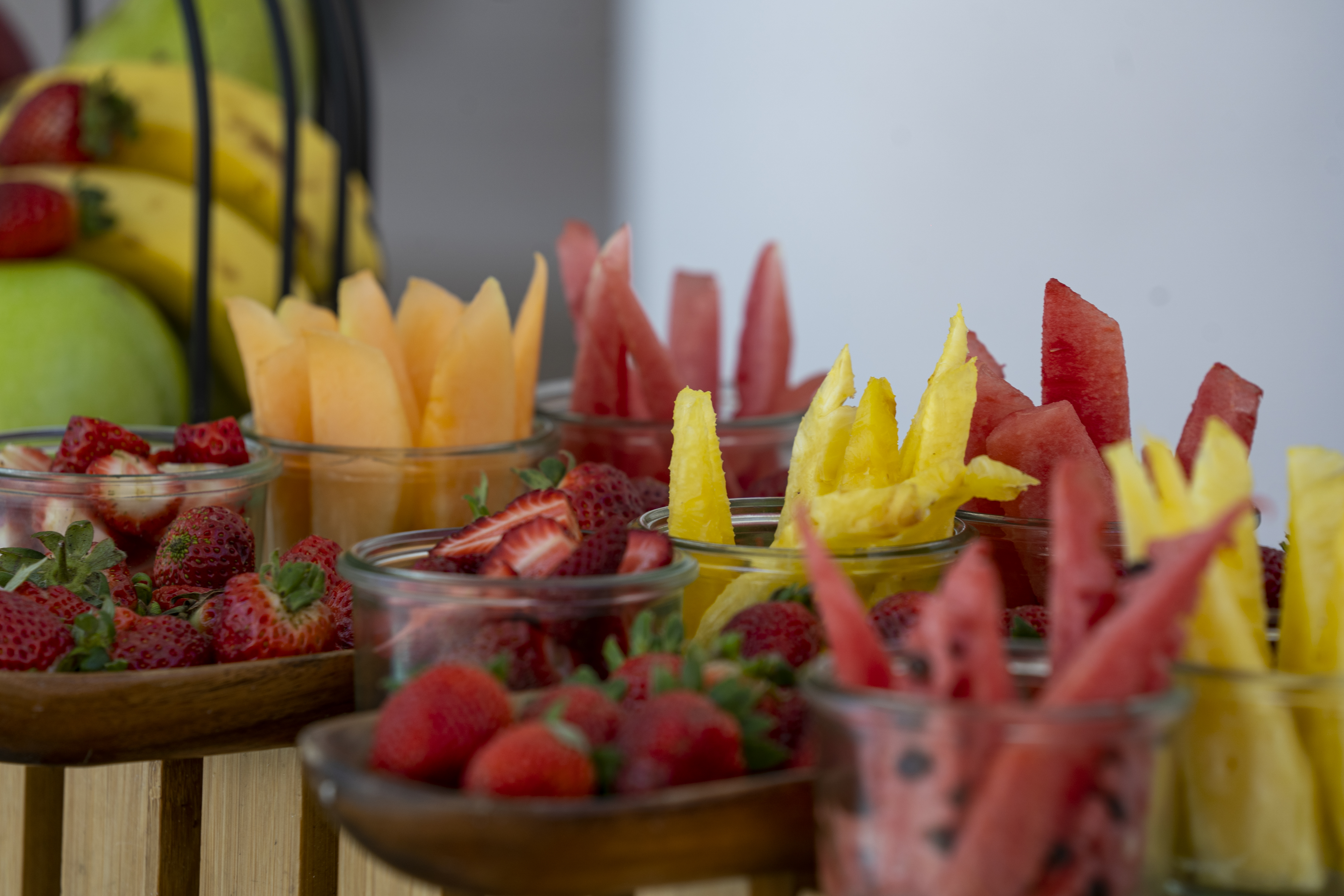 a group of bowls of fruit