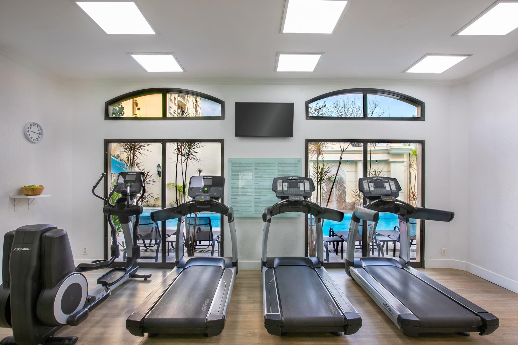 a room with treadmills and a tv
