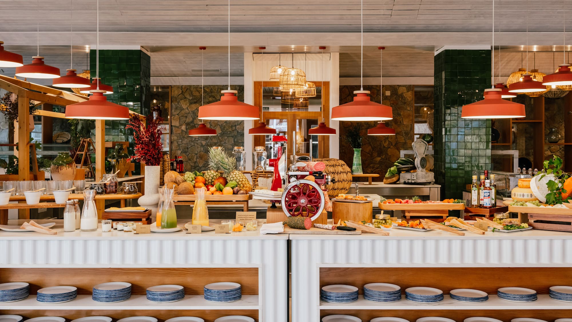 a food buffet with plates and fruits