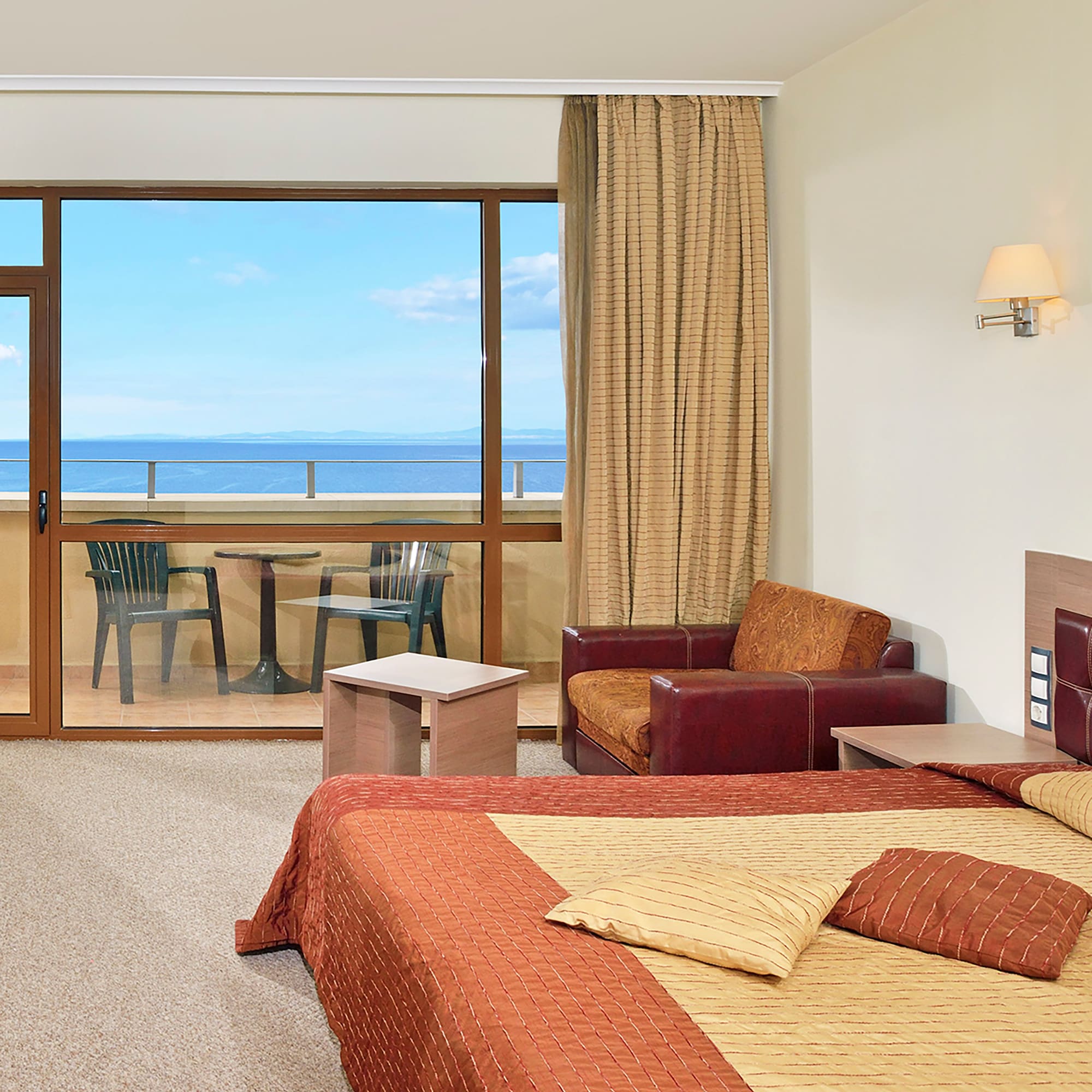 a room with a bed and a glass door