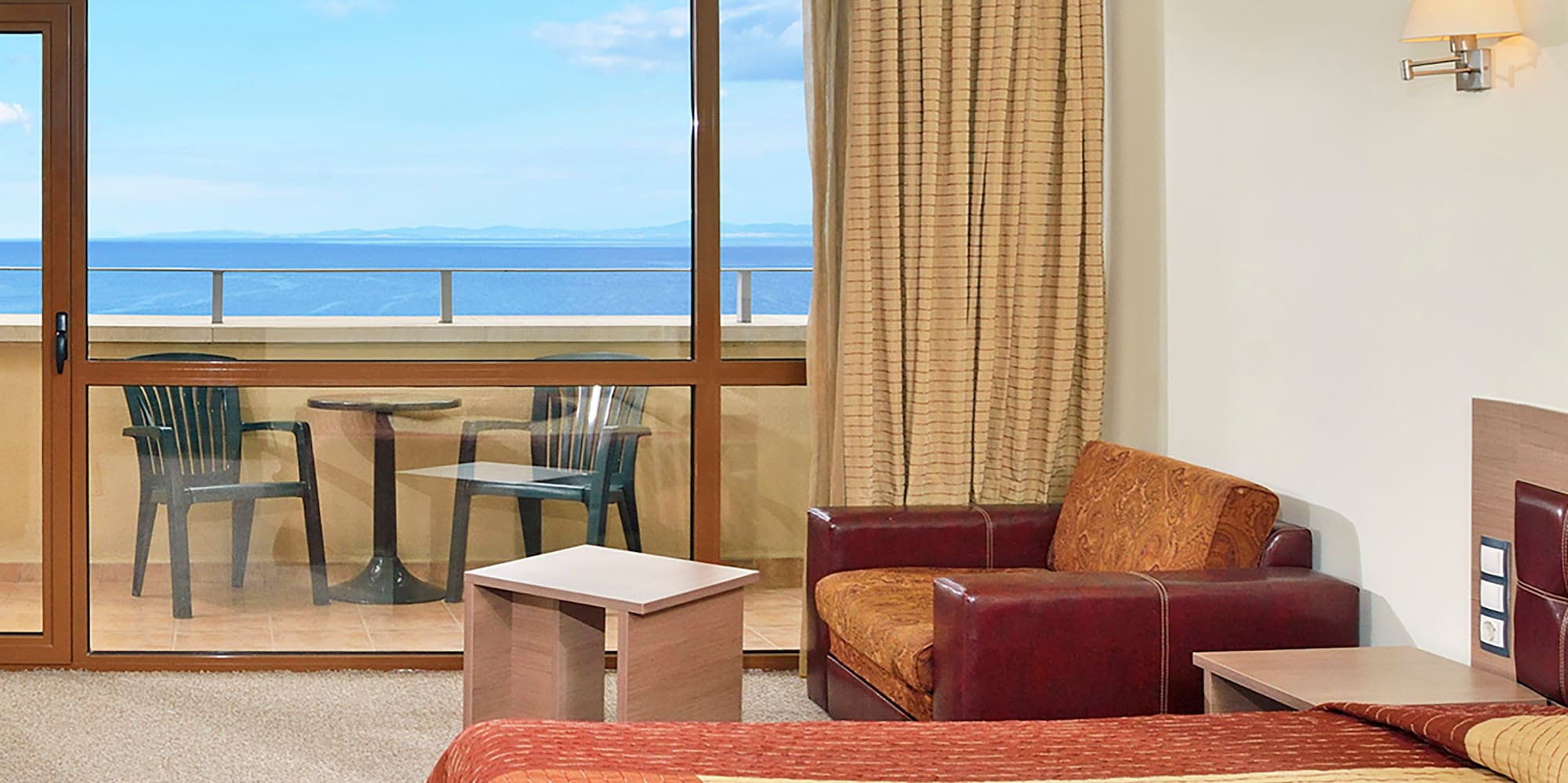 a room with a bed and a glass door