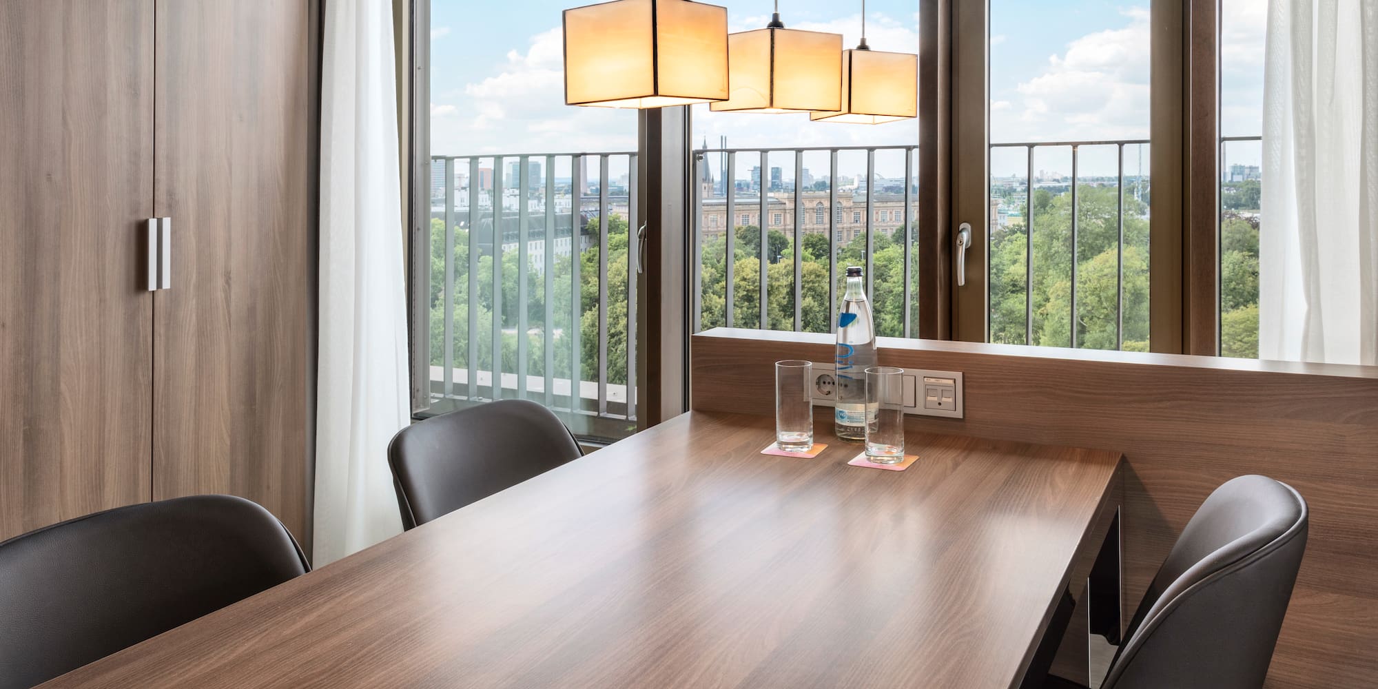 a table with chairs and a bottle of water on it