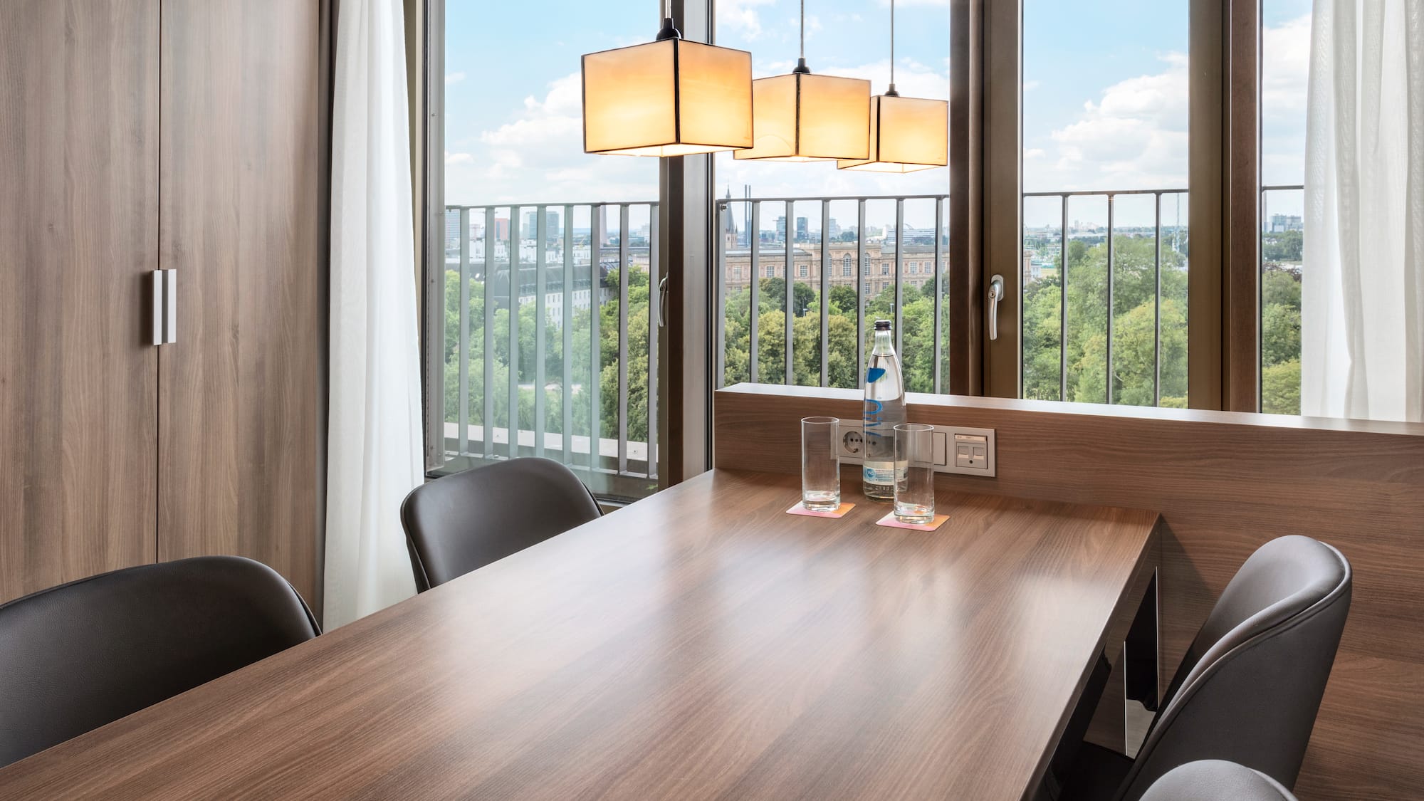 a table with chairs and a bottle of water on it