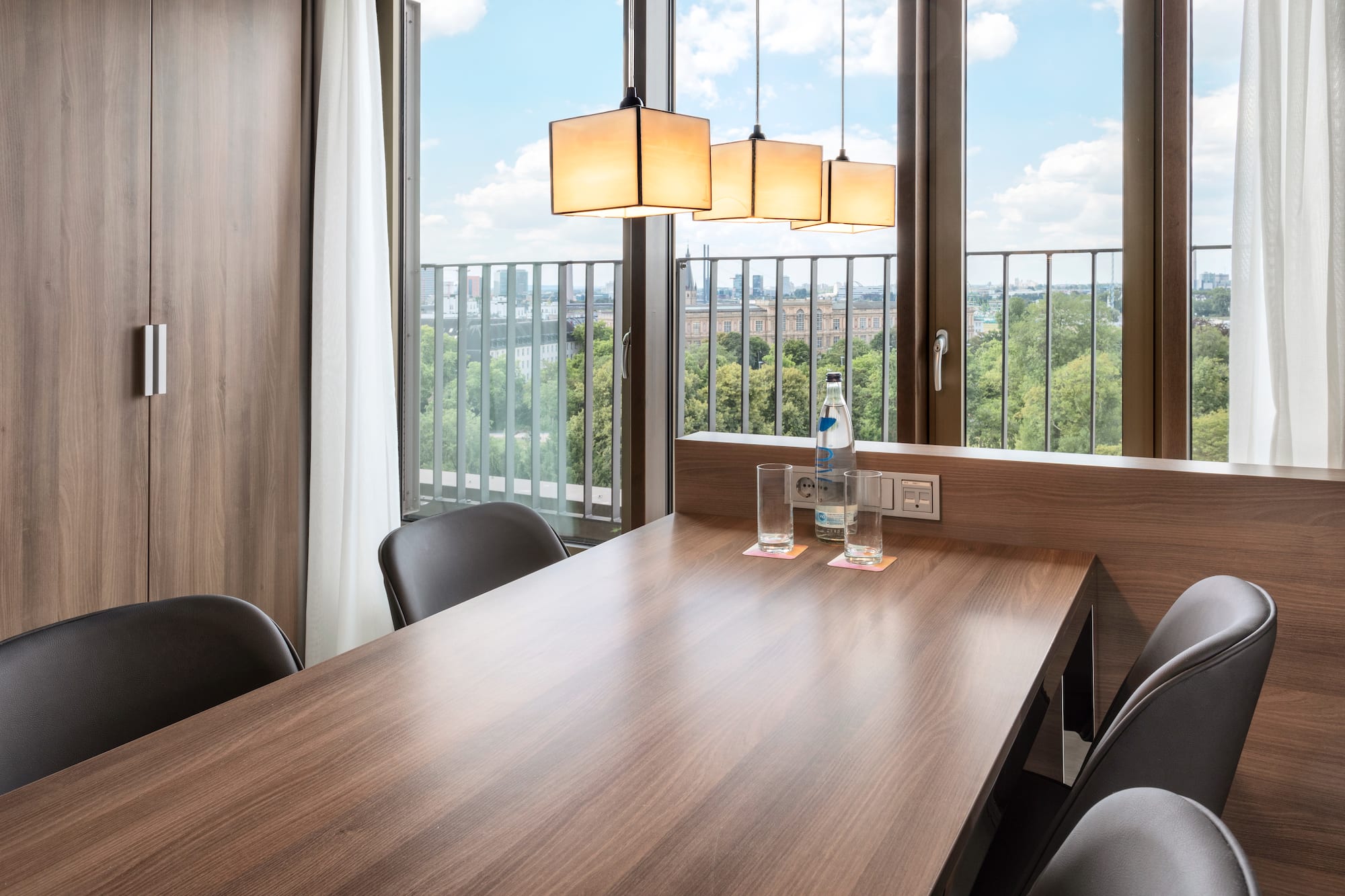 a table with chairs and a bottle of water on it