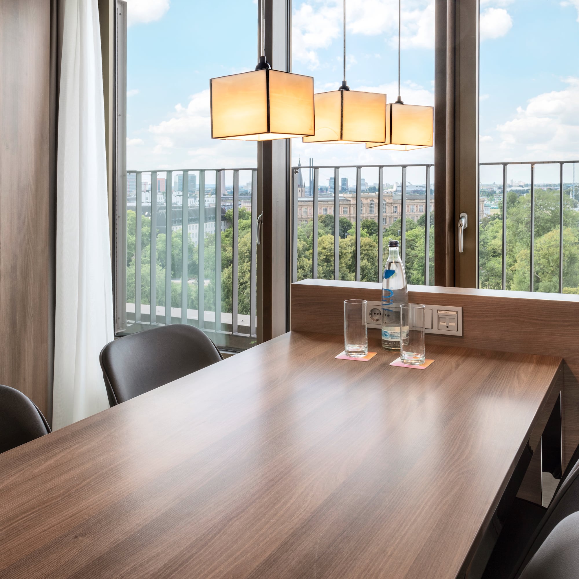 a table with chairs and a bottle of water on it
