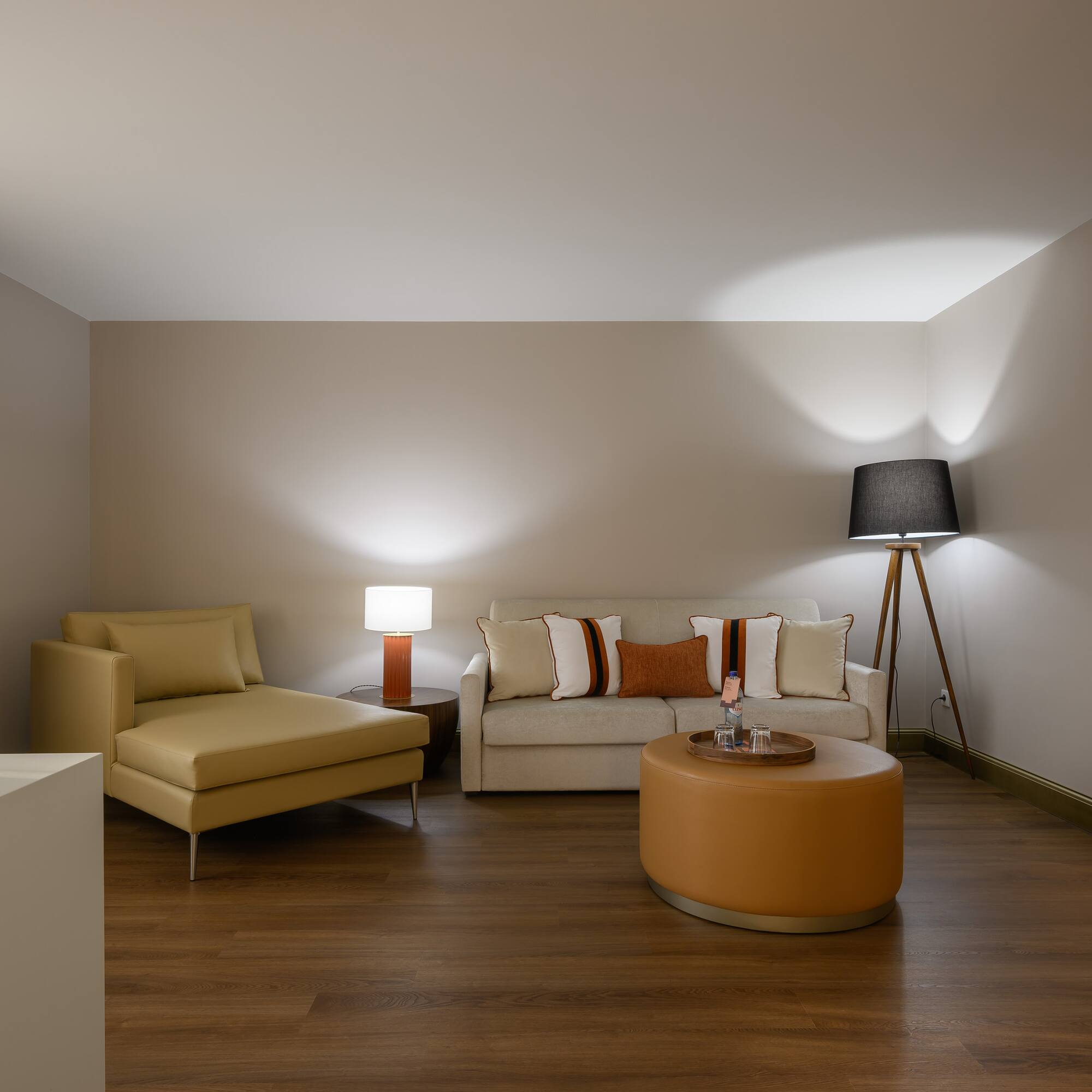 a room with a couch and a lamp