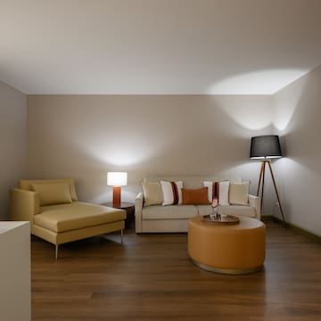 a room with a couch and a lamp