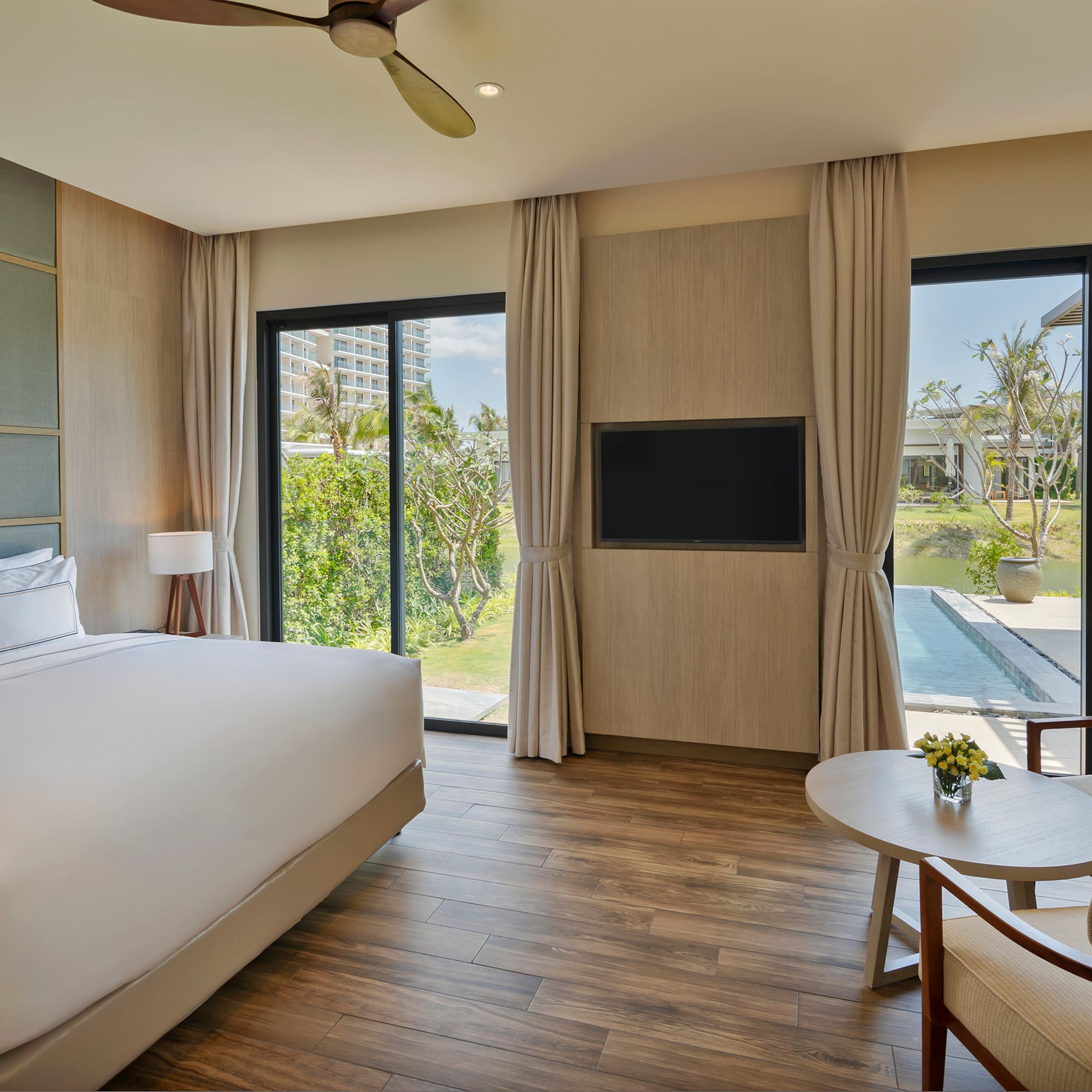 a room with a bed and a television