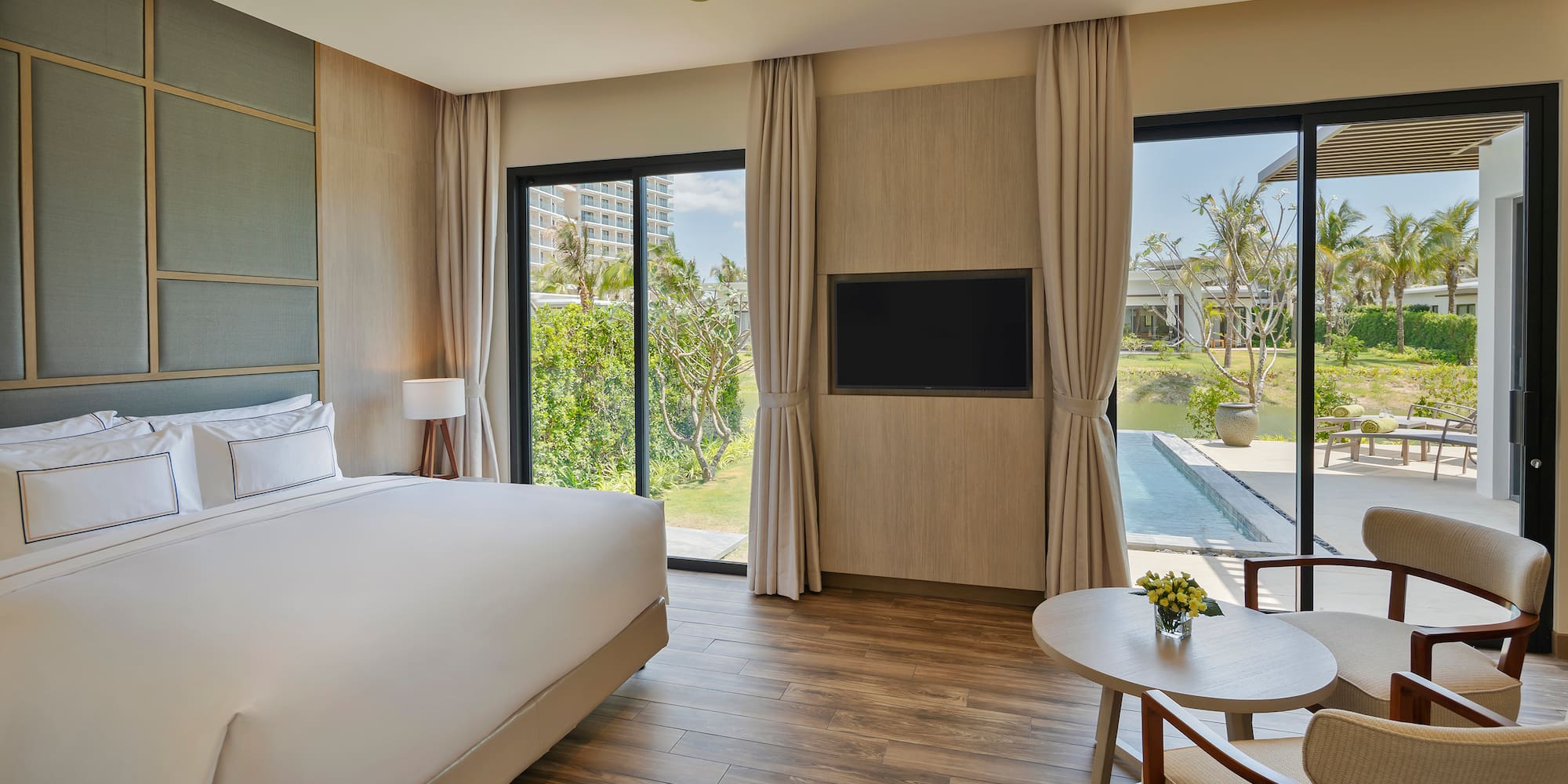 a room with a bed and a television