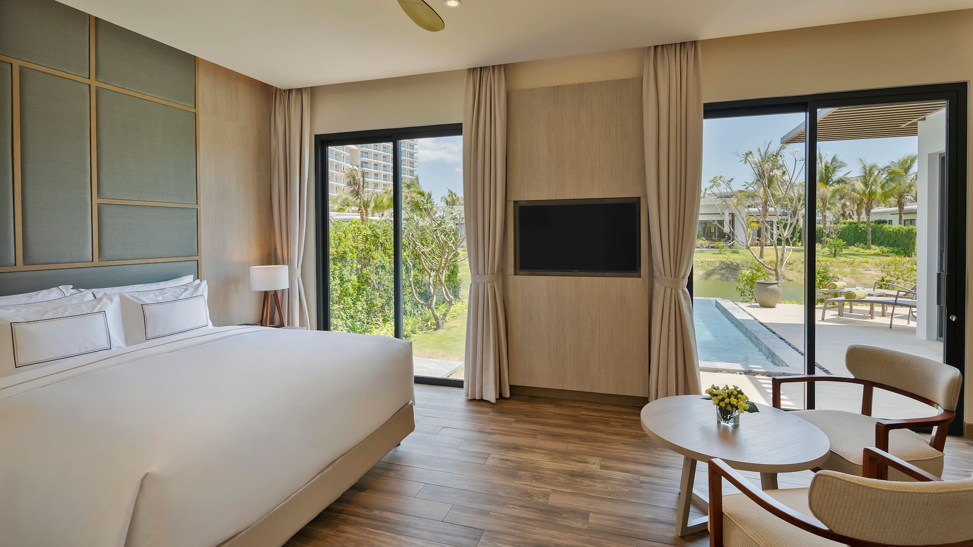 a room with a bed and a television