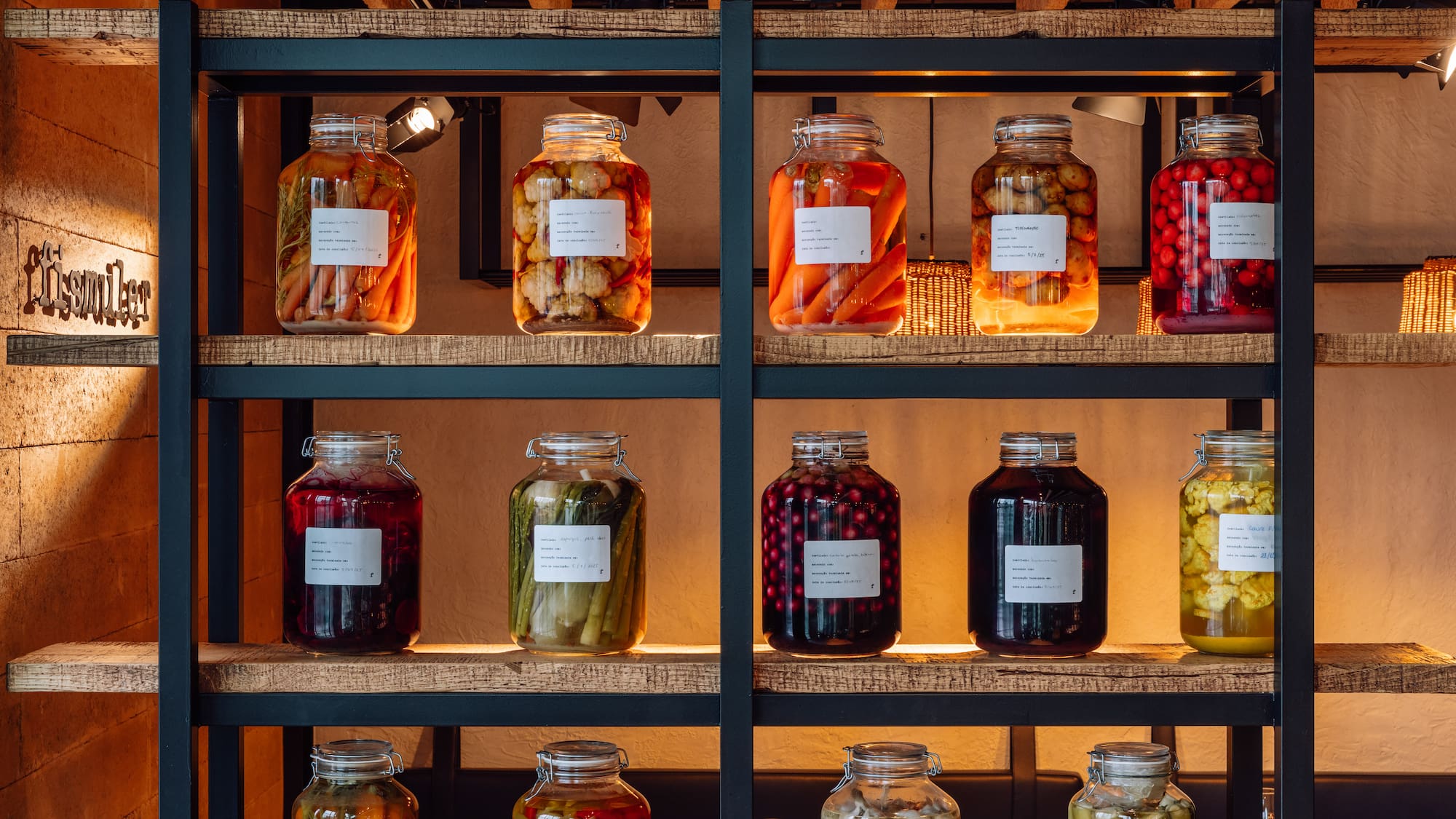 a shelf with jars of food
