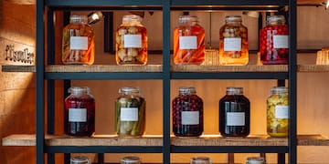 a shelf with jars of food