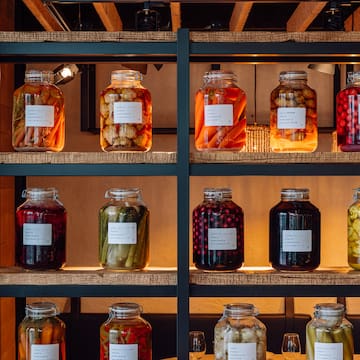 a shelf with jars of food