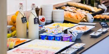 a buffet table with different foods