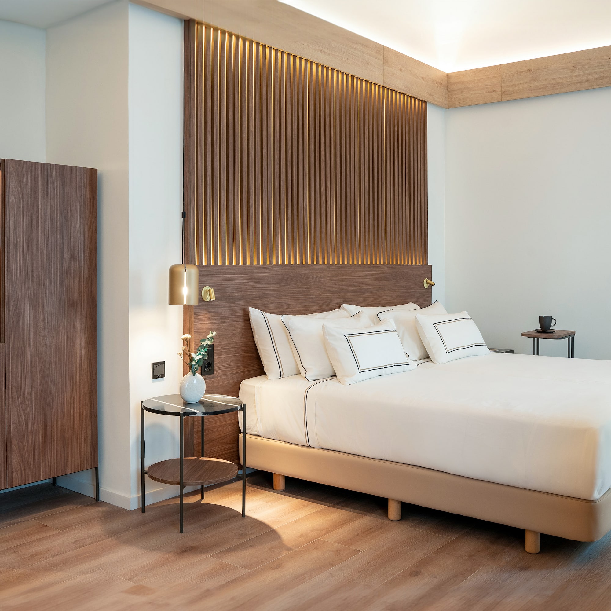 a bedroom with a bed and a cabinet