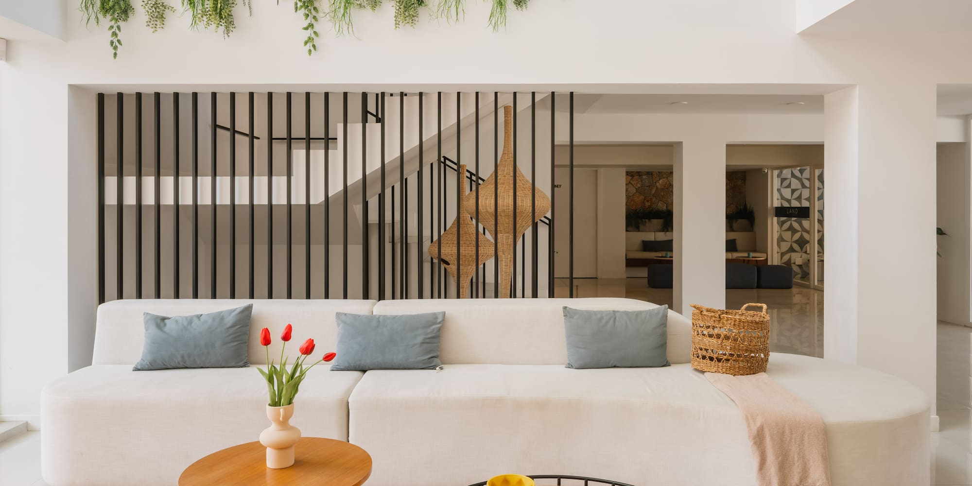 a living room with a white couch and a coffee table