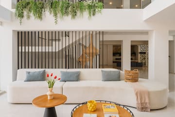 a living room with a white couch and a coffee table