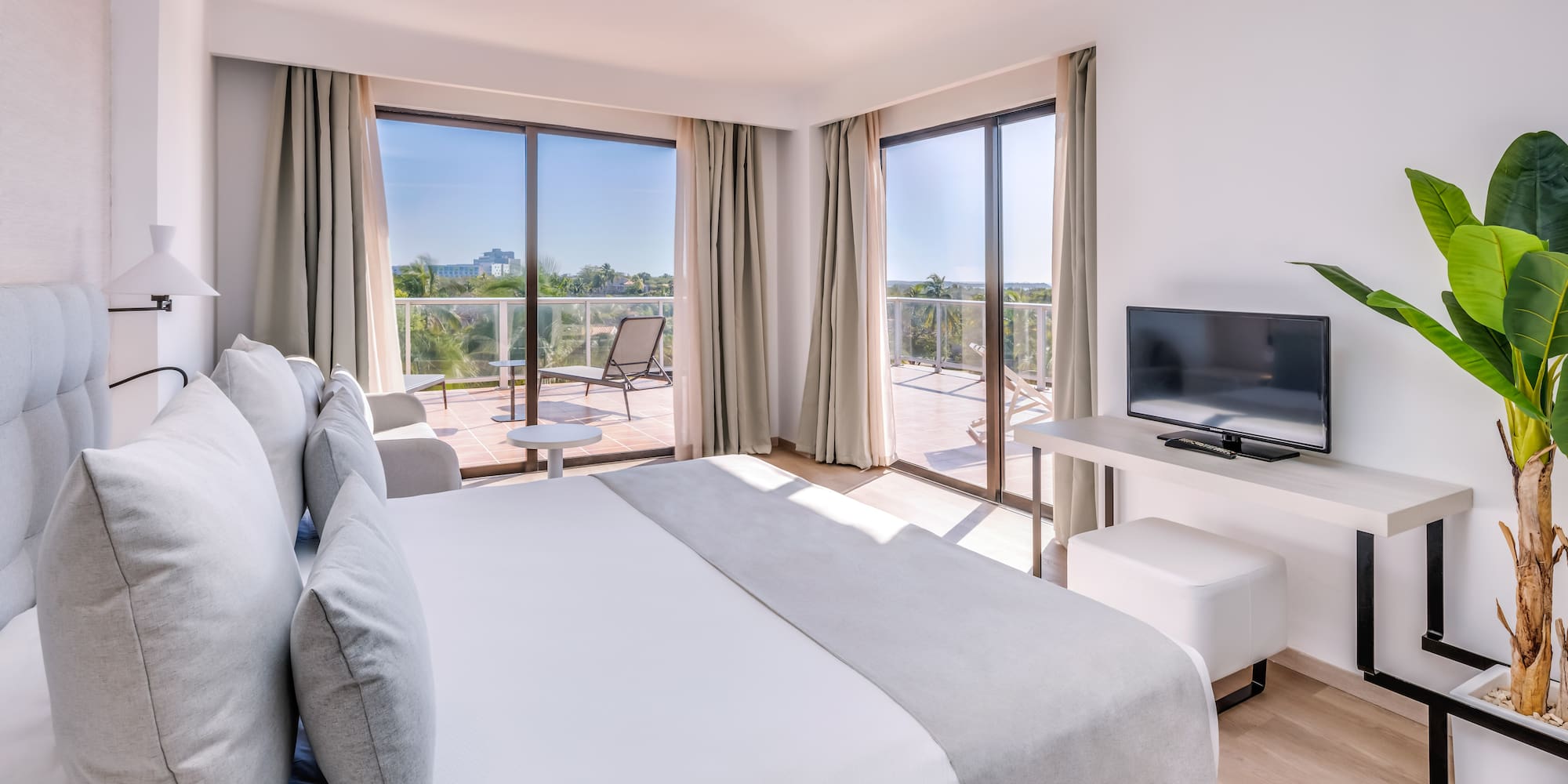 a bedroom with a television and a bed