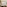 Luxury hotel room with king bed, wavy wooden headboard, tropical view.