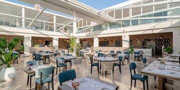 a large room with tables and chairs