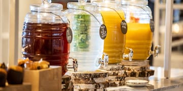 a row of different colored drinks