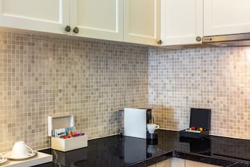 a kitchen with a black counter top