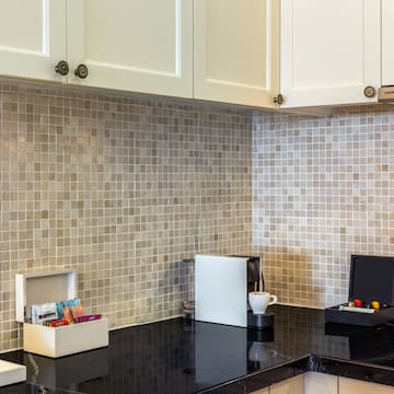 a kitchen with a black counter top