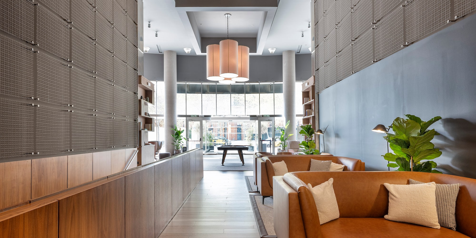 a lobby with a couch and a table