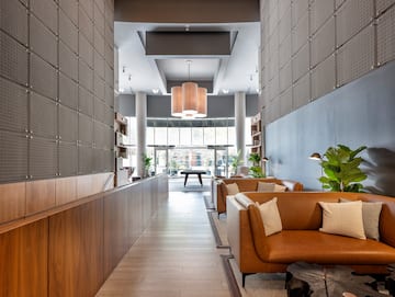 a lobby with a couch and a table